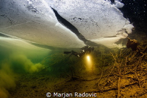 Under the Ice / Plitvice lake /national park by Marjan Radovic 